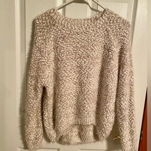Soft and cozy sweater perfect for the colder months. High/low hem.